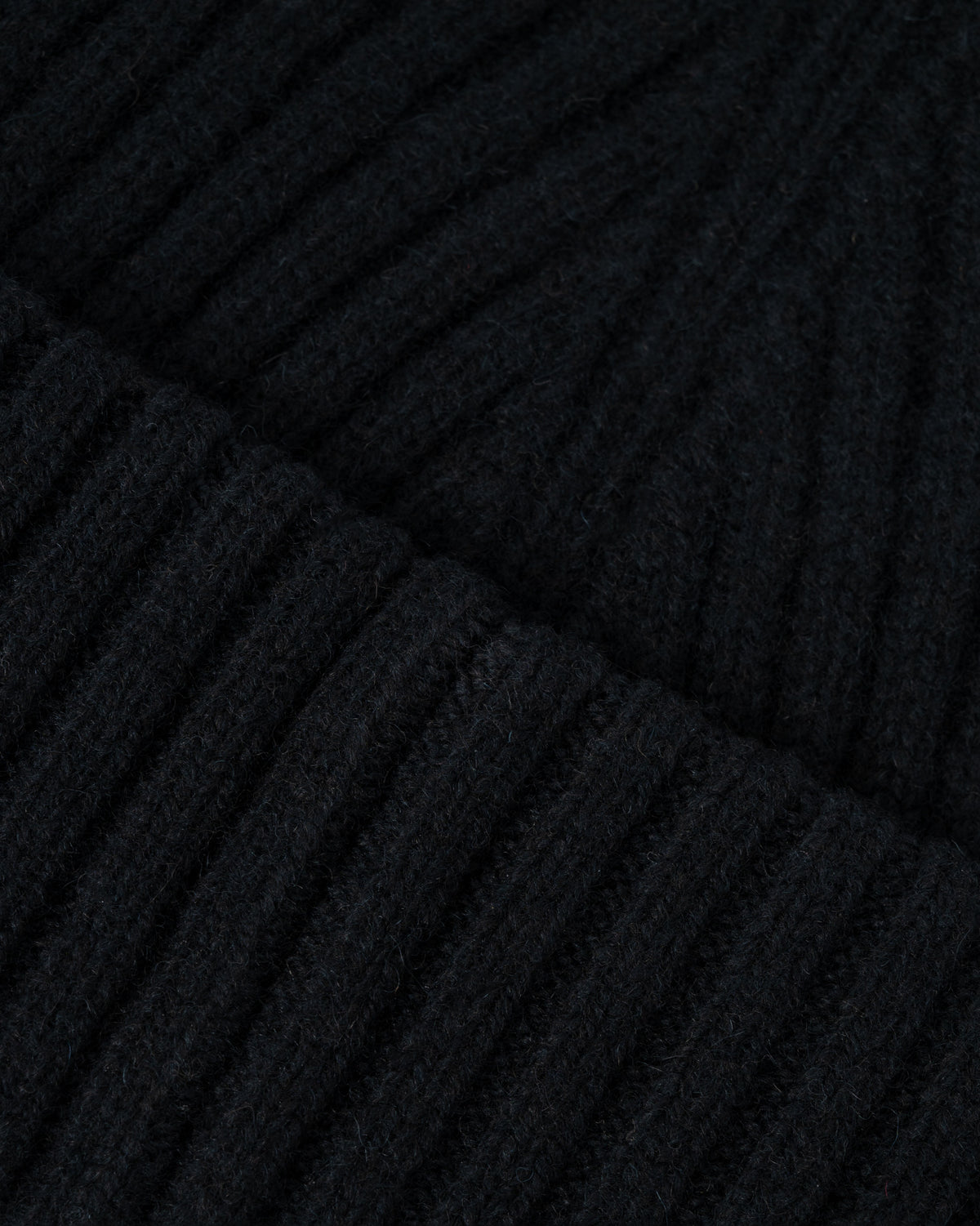 Close up of the Fred Perry Mens Ribbed Wool Beanie - Black 102