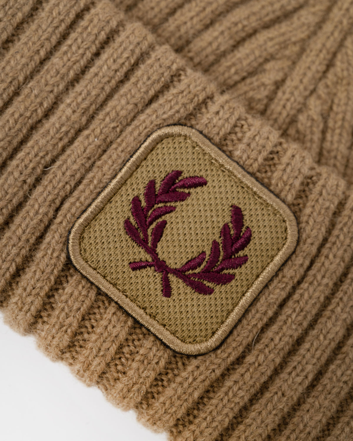 Close up on the Fred Perry Mens Ribbed Wool Beanie - Bronze 31C