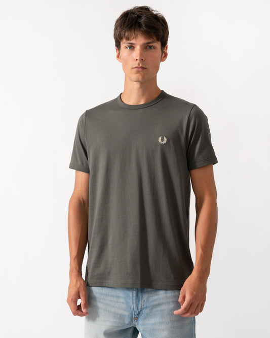 model wearing a Fred Perry Mens Ringer T-Shirt in Field Green 148