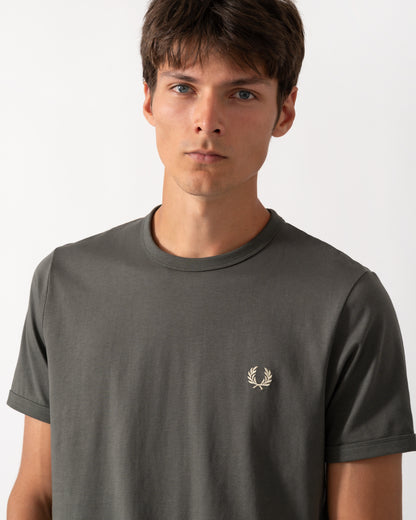 close up of a model wearing a Fred Perry Mens Ringer T-Shirt in Field Green 148
