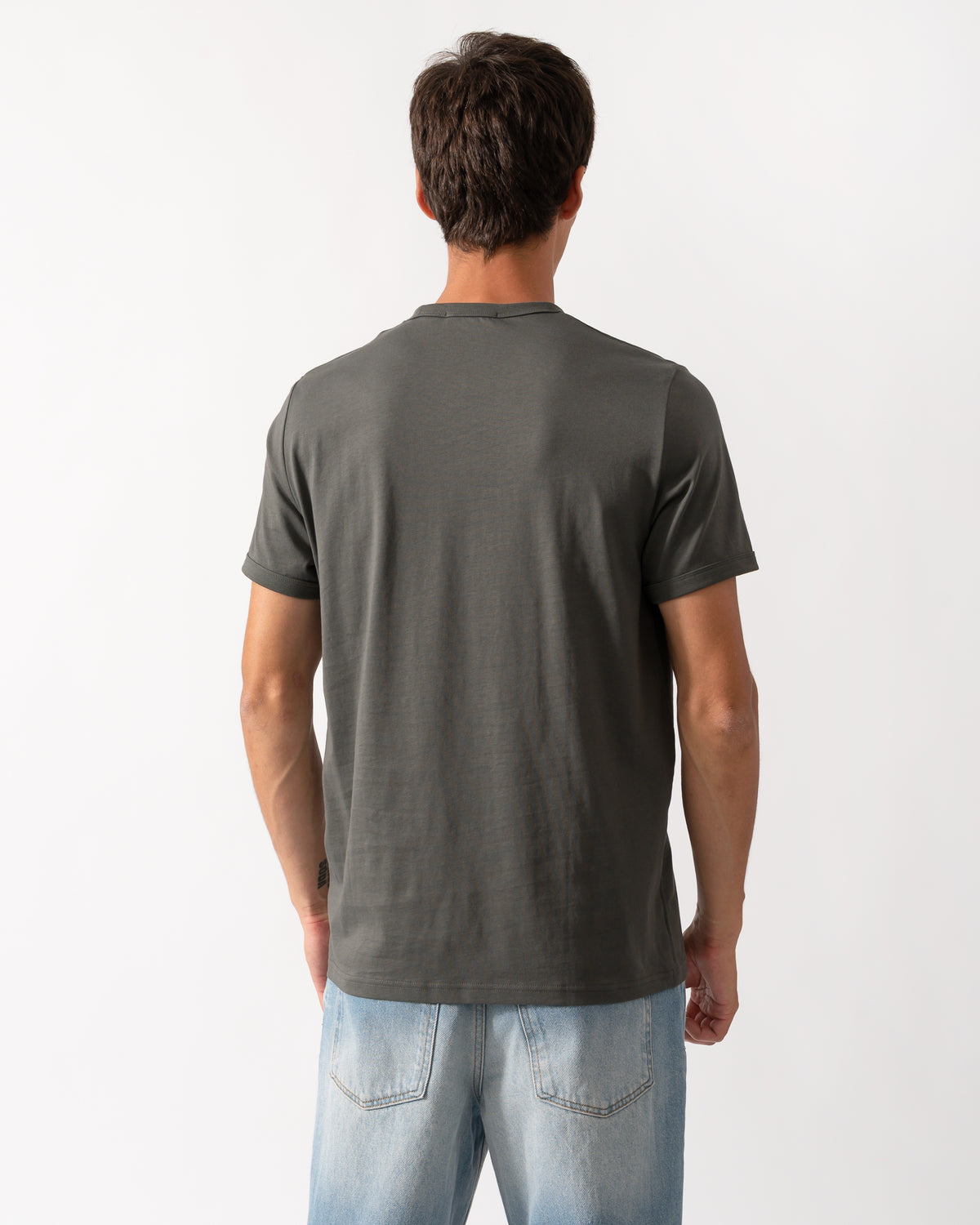 back of model wearing a Fred Perry Mens Ringer T-Shirt in Field Green 148
