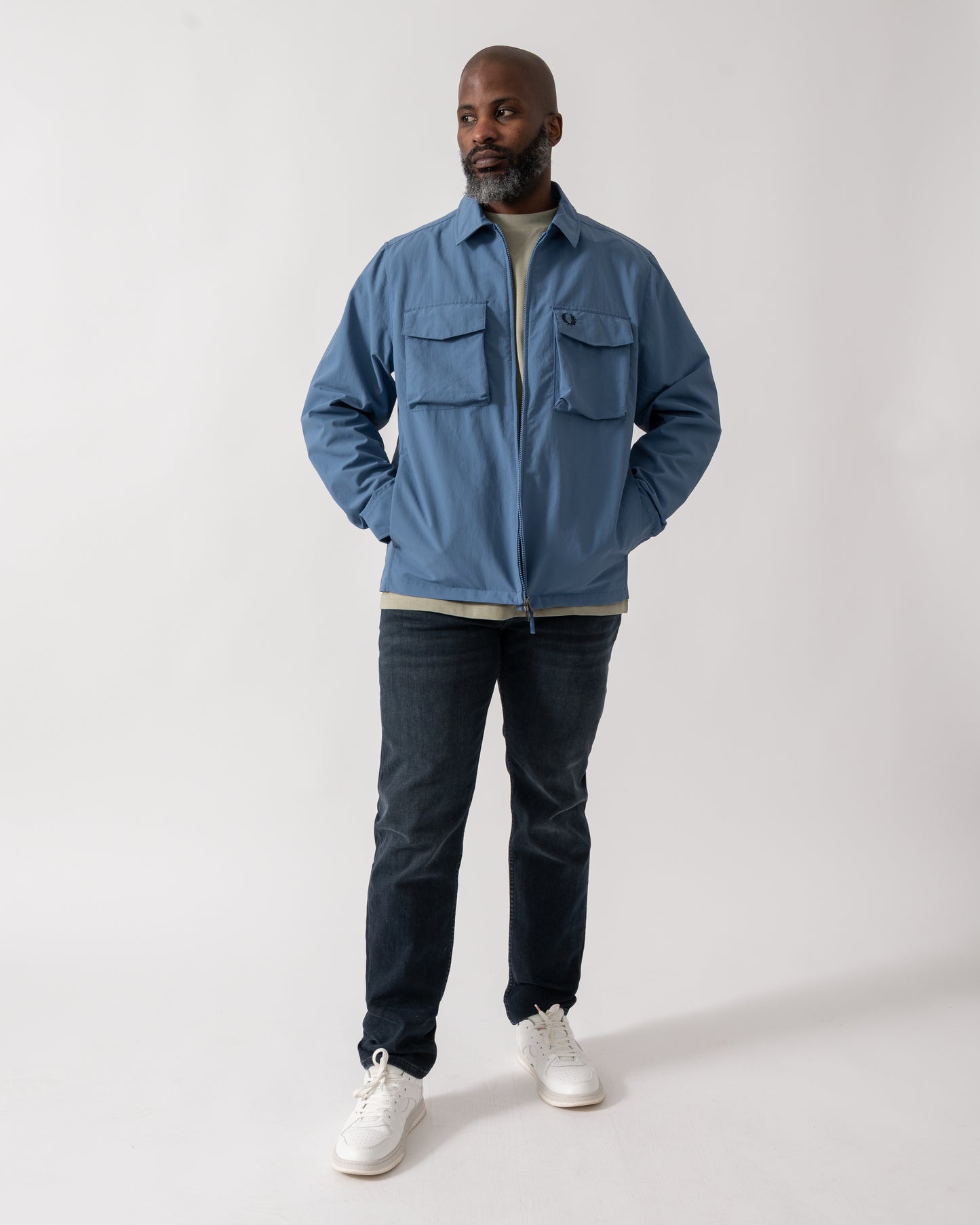 Full length shot of a Model wearing a Fred Perry Mens Ripstop Pocket Overshirt in Ace Blue