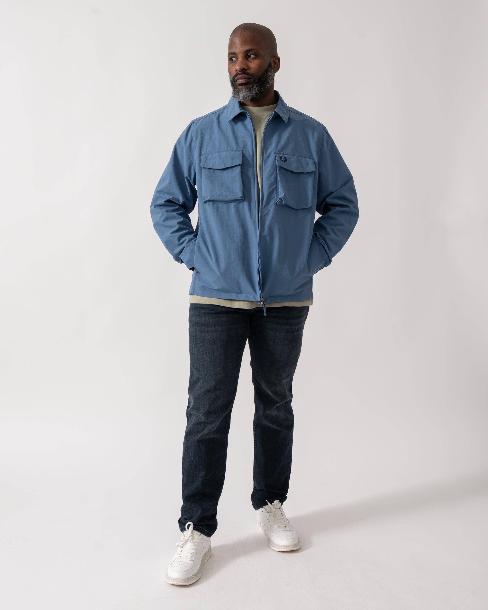 Full length shot of a Model wearing a Fred Perry Mens Ripstop Pocket Overshirt in Ace Blue