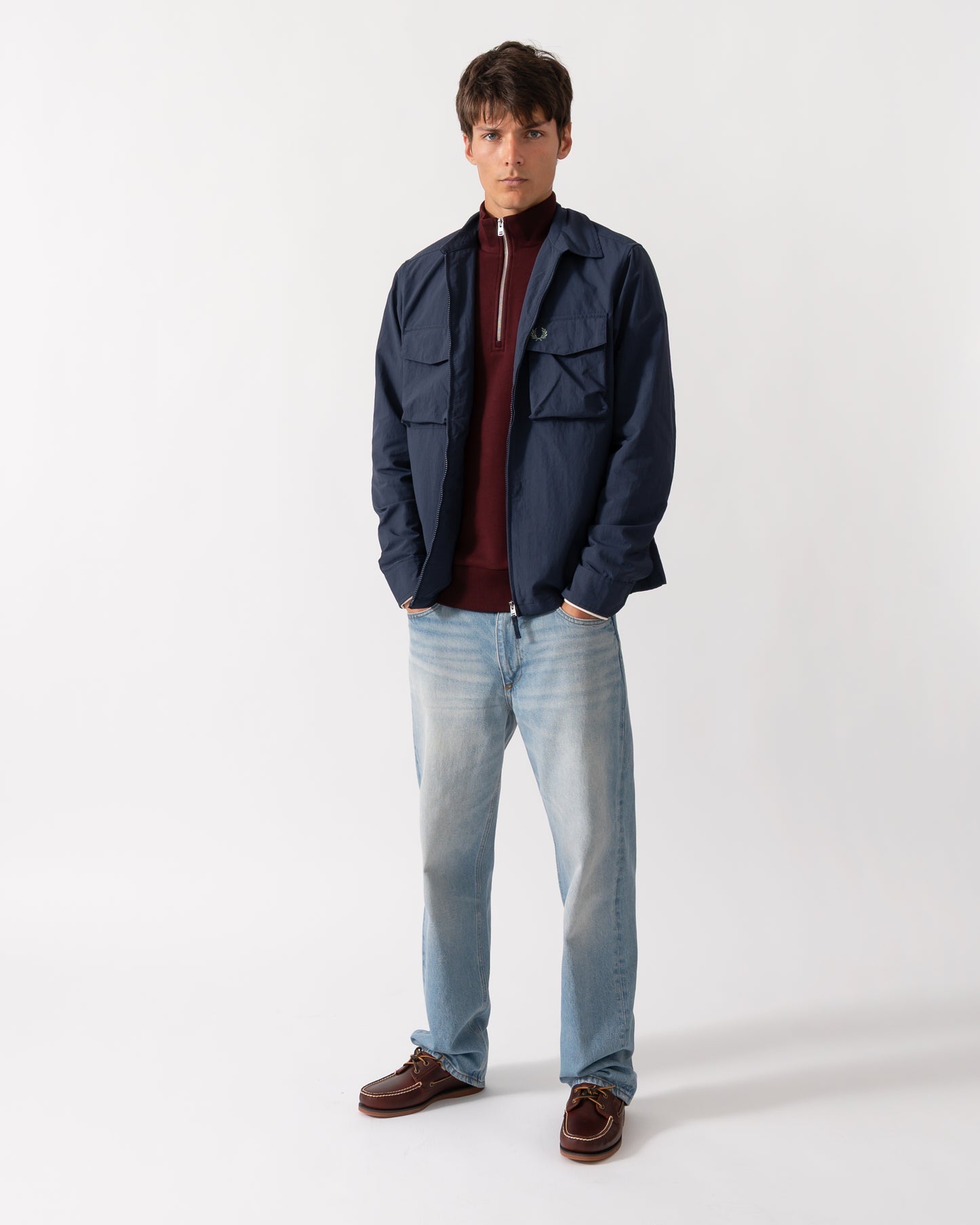 full length shot of a model wearing a Fred Perry Mens Ripstop Pocket Overshirt in Dark Airforce 738