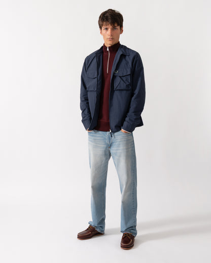 full length shot of a model wearing a Fred Perry Mens Ripstop Pocket Overshirt in Dark Airforce 738