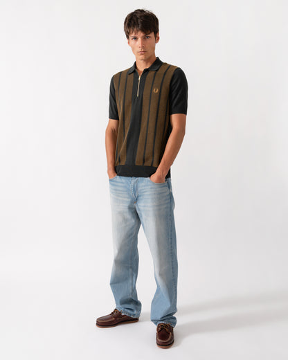full llength shot of a model wearing a Fred Perry Mens Textured Panel Knitted Polo Shirt in Night Green Q20
