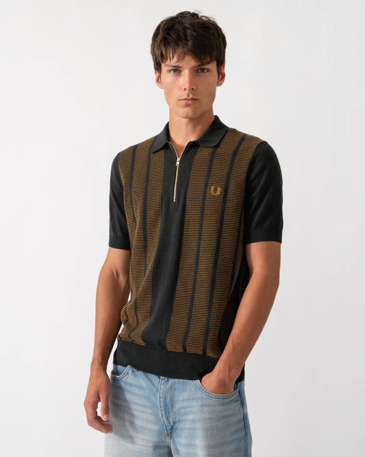 model wearing a Fred Perry Mens Textured Panel Knitted Polo Shirt in Night Green Q20