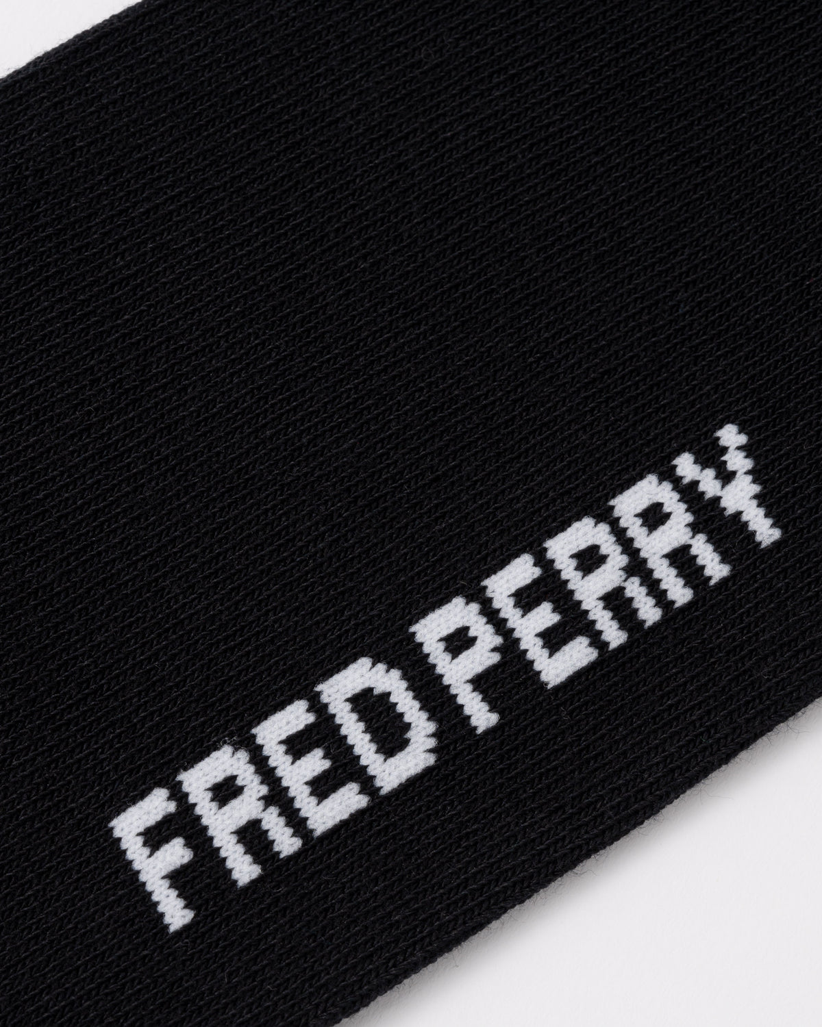 Logo on the Fred Perry Mens Tipped Sports Sock - Black/Snow White 843
