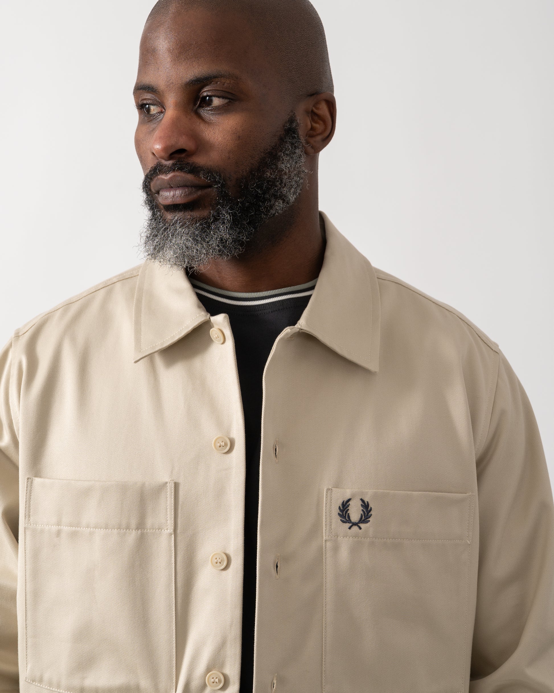 close up shot of a Model wearing a Fred Perry Mens Twill Overshirt in Oatmeal