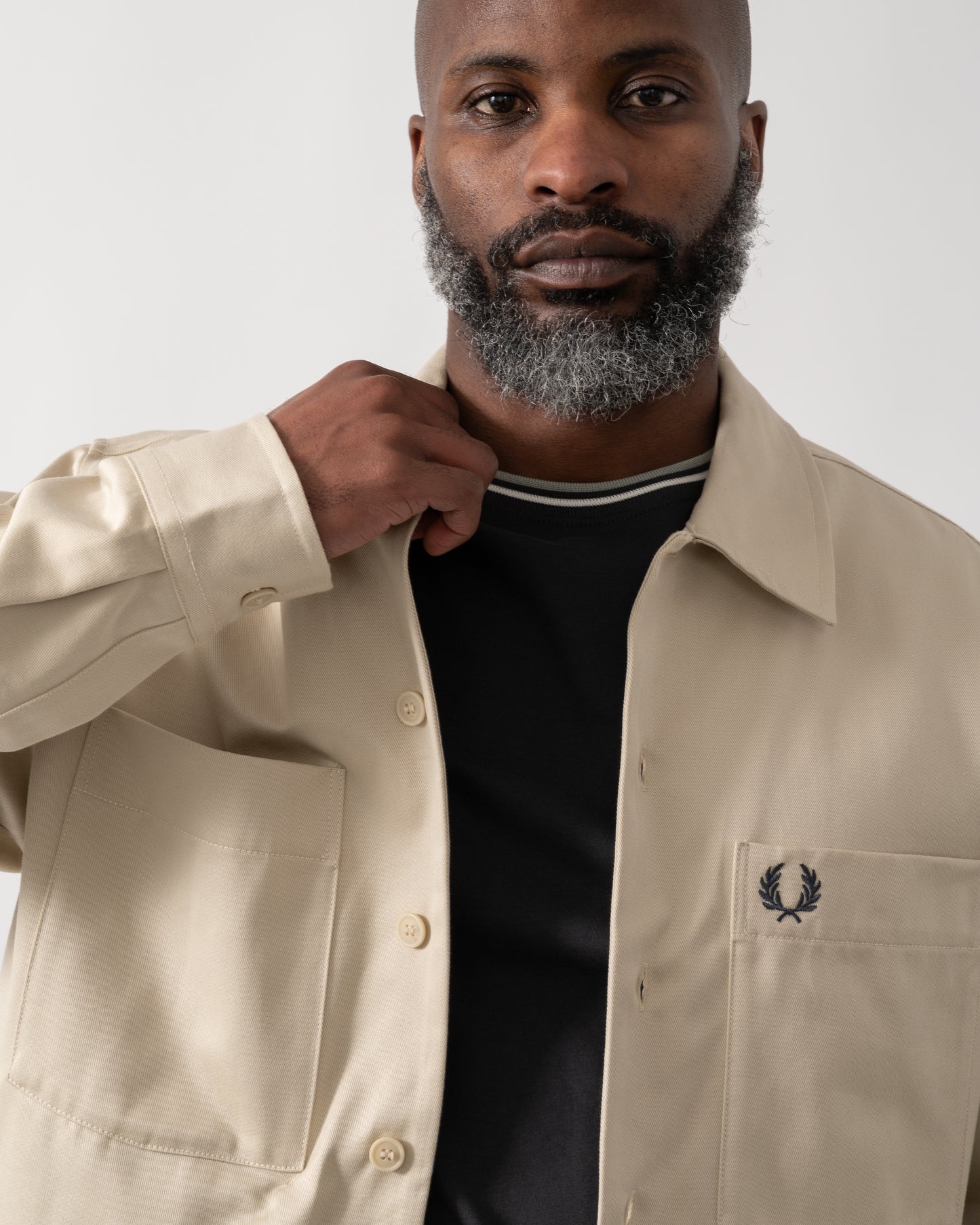 detail shot of a Model wearing a Fred Perry Mens Twill Overshirt in Oatmeal