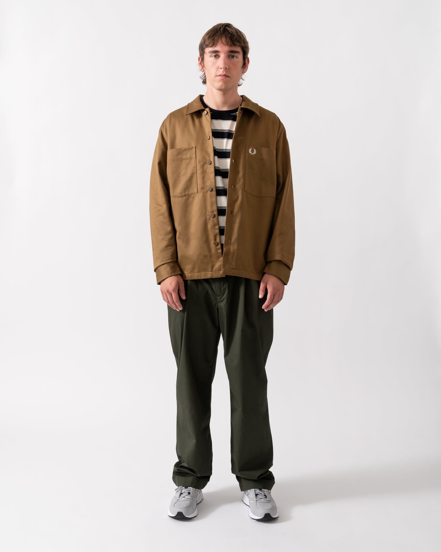 full length of a model wearing a Fred Perry Mens Twill Overshirt in Shaded Stone P96