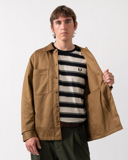 detail of a model wearing a Fred Perry Mens Twill Overshirt in Shaded Stone P96