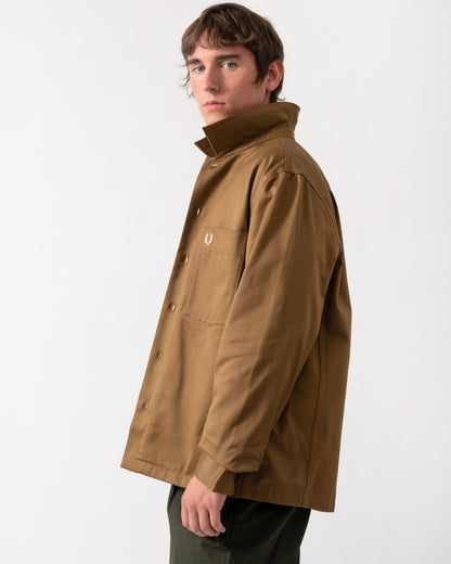 side view of a model wearing a Fred Perry Mens Twill Overshirt in Shaded Stone P96