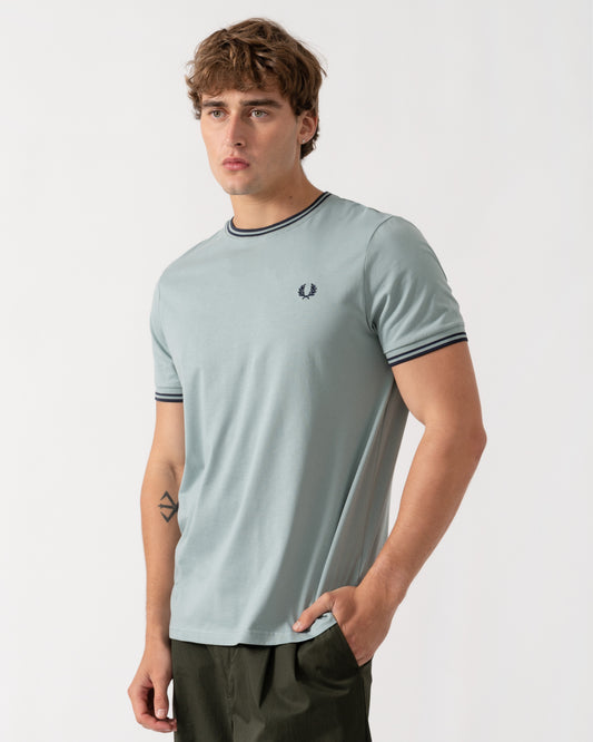 Model wearing Fred Perry Mens Twin Tipped T-Shirt - Silver Blue/Dark Airforce 71C