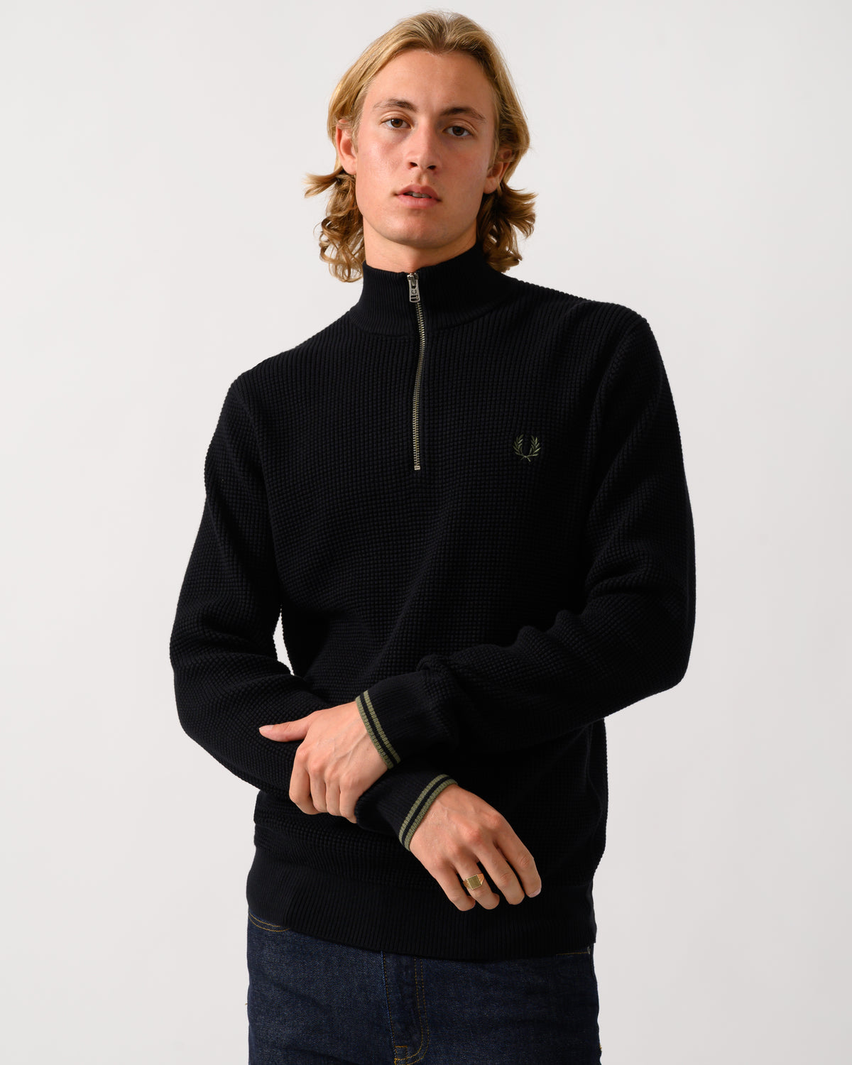model wearing a Fred Perry Mens Waffle Stitch Half Zip Jumper in Black 198