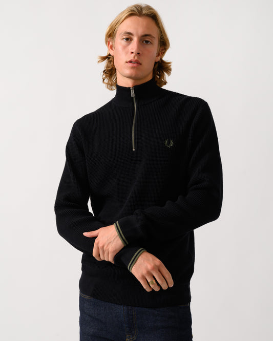 model wearing a Fred Perry Mens Waffle Stitch Half Zip Jumper in Black 198