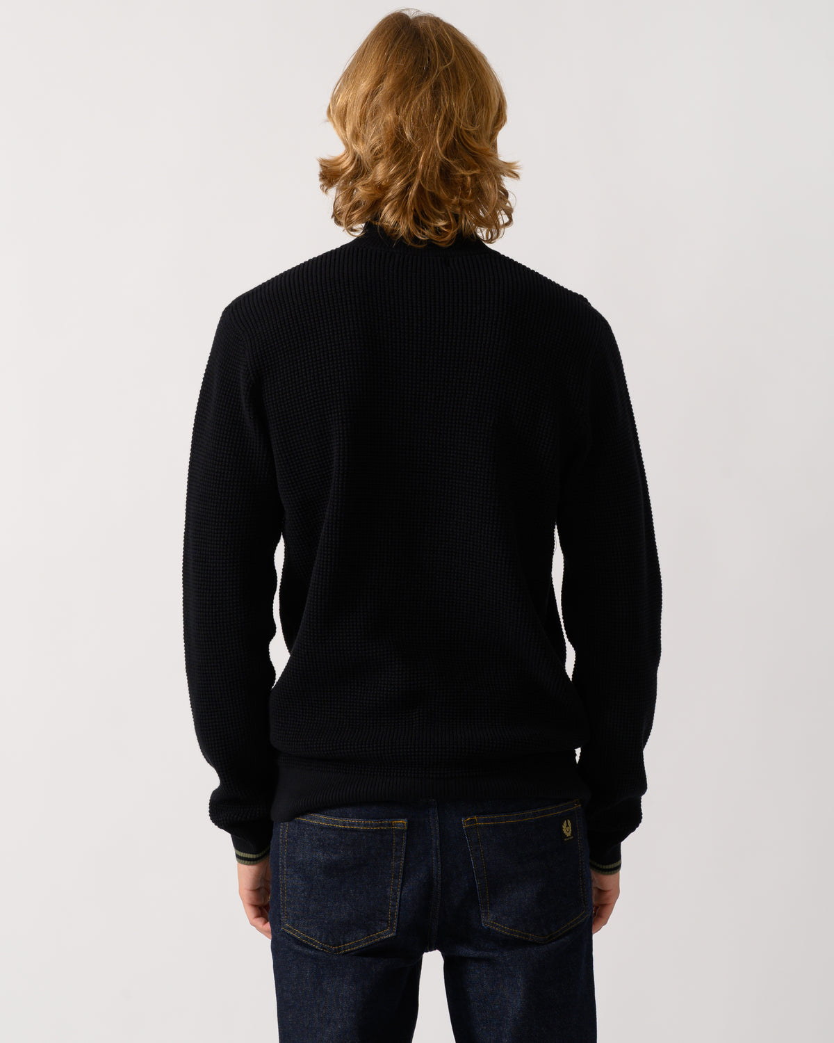back of a model wearing a Fred Perry Mens Waffle Stitch Half Zip Jumper in Black 198