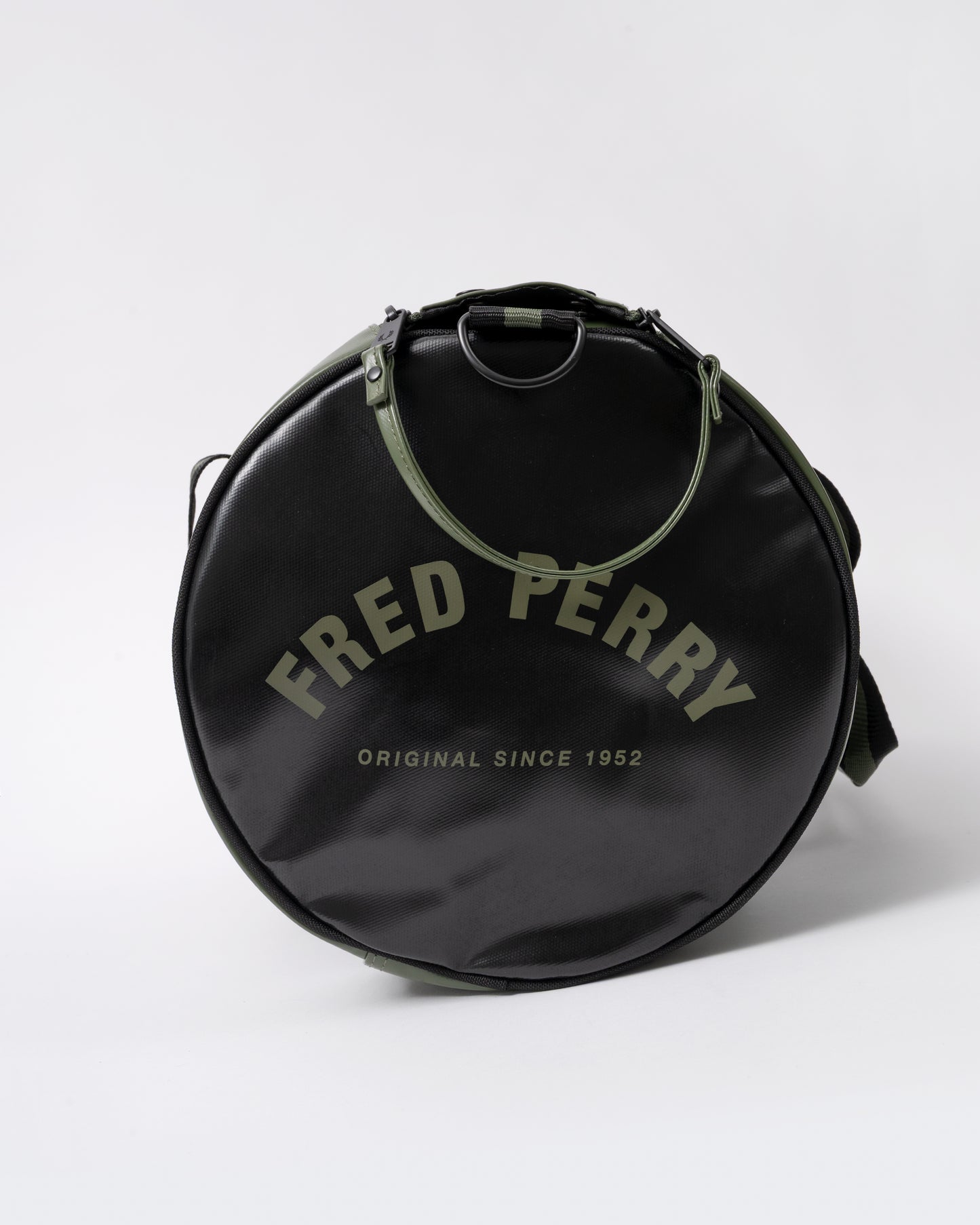 end view of a Fred Perry Recycled Polyester Classic Barrel Bag in Laurel Wreath Green and Black Z50