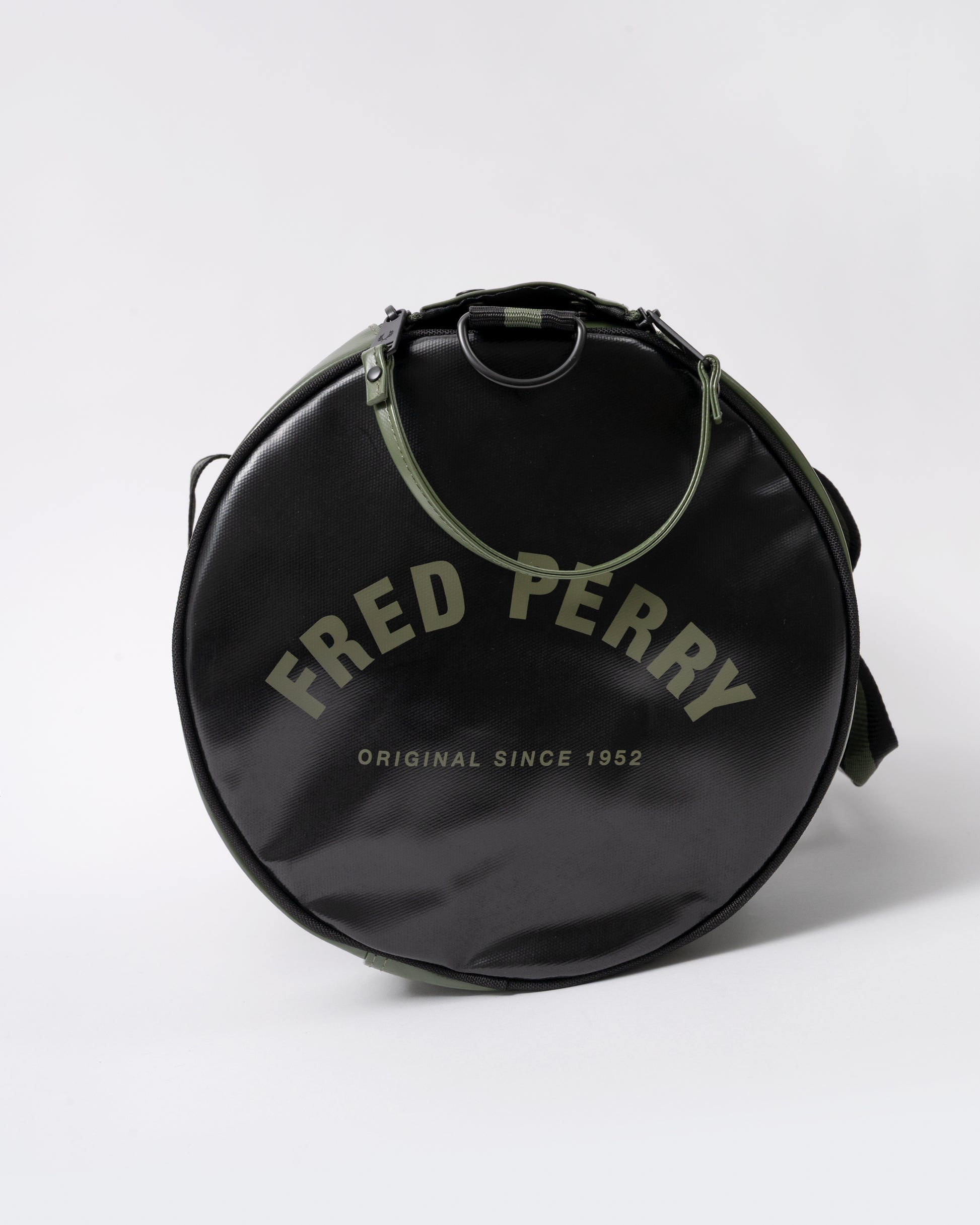 end view of a Fred Perry Recycled Polyester Classic Barrel Bag in Laurel Wreath Green and Black Z50