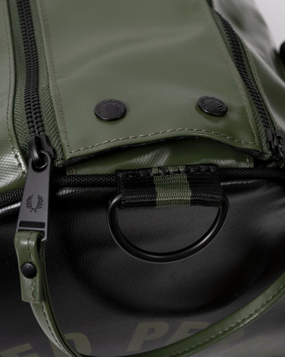 zipper and closure detail of a Fred Perry Recycled Polyester Classic Barrel Bag in Laurel Wreath Green and Black Z50