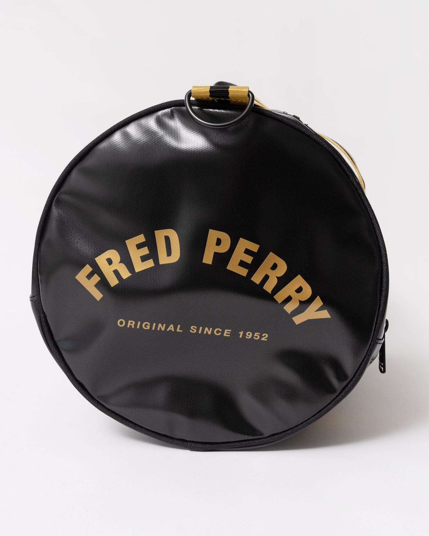 Side view of Fred Perry Tipped Classic Barrel Bag - Black/Gold 774