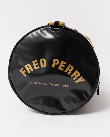 Side view of Fred Perry Tipped Classic Barrel Bag - Black/Gold 774