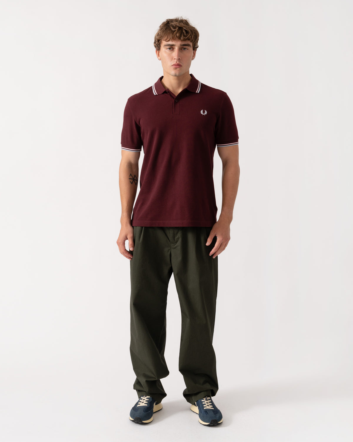 Outfit shot of Fred Perry Mens Twin Tipped Signature Polo Shirt - Oxblood/Iced Pink/Dusk Blue 83C