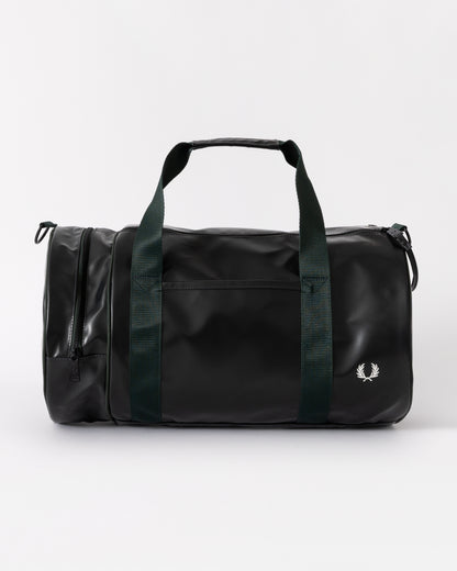 Black duffel bag with green straps on a white background