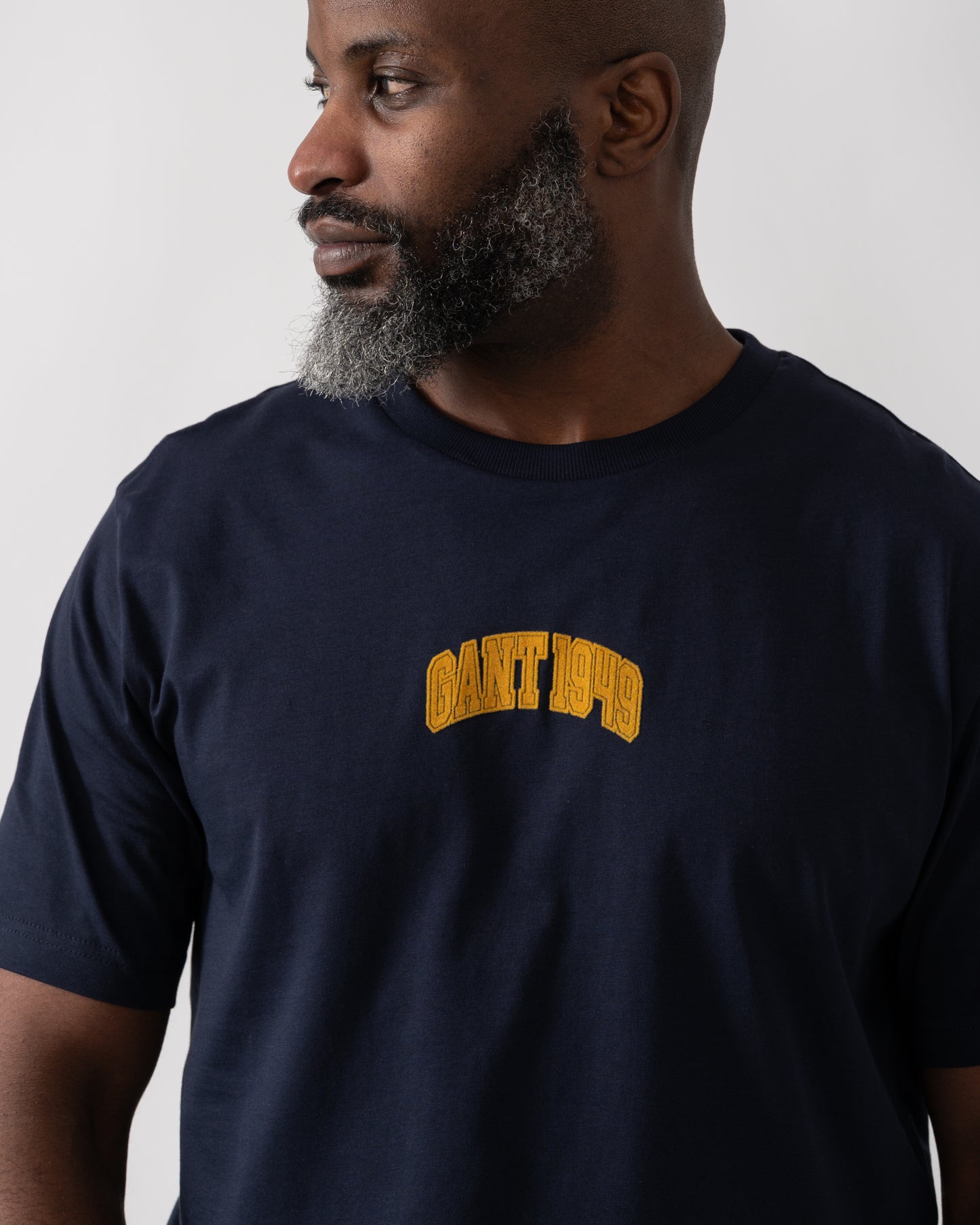 Detail shot of a Model wearing a GANT Mens 1949 Graphic Short Sleeve T-Shirt in Evening Blue