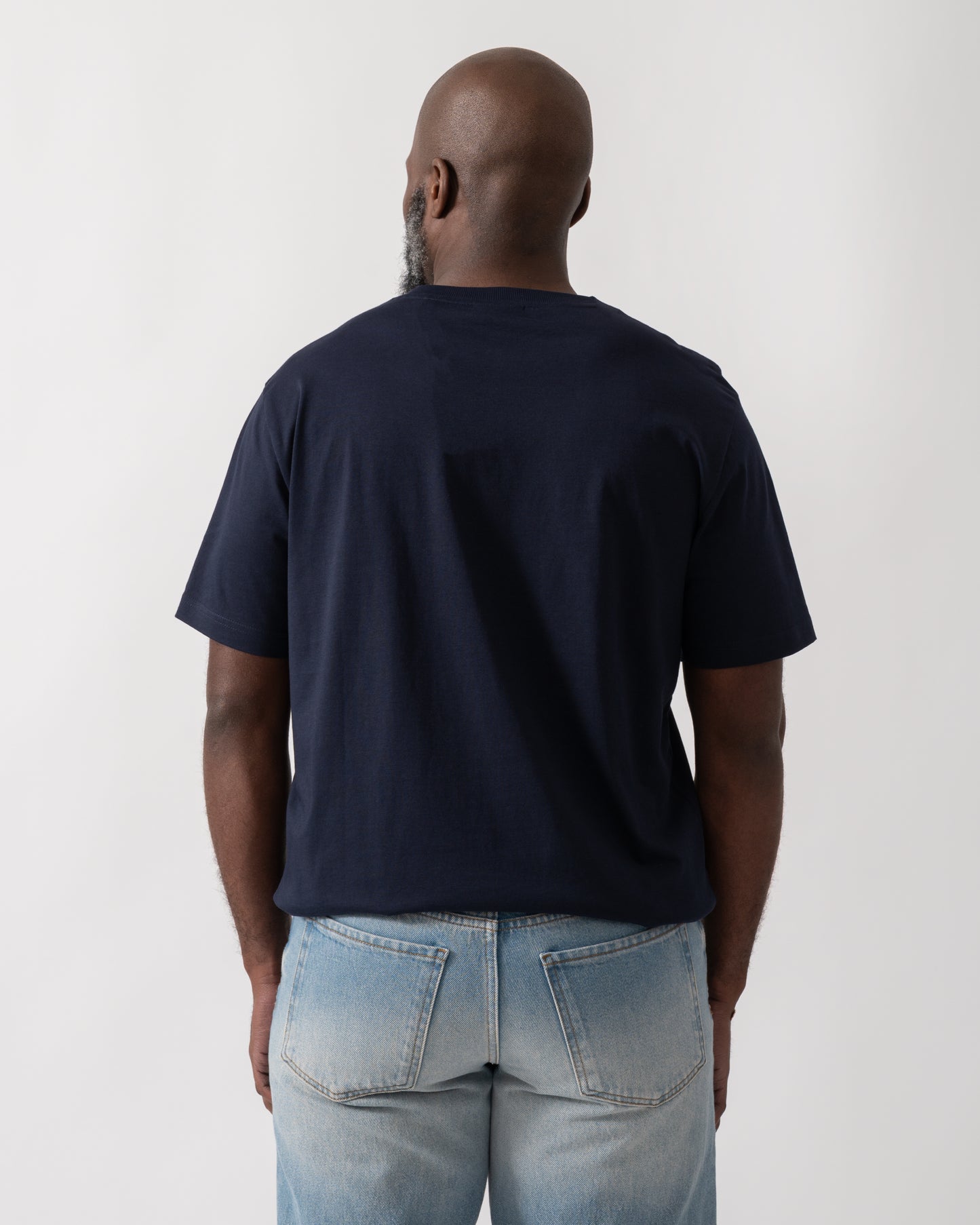 Back shot of a Model wearing a GANT Mens 1949 Graphic Short Sleeve T-Shirt in Evening Blue