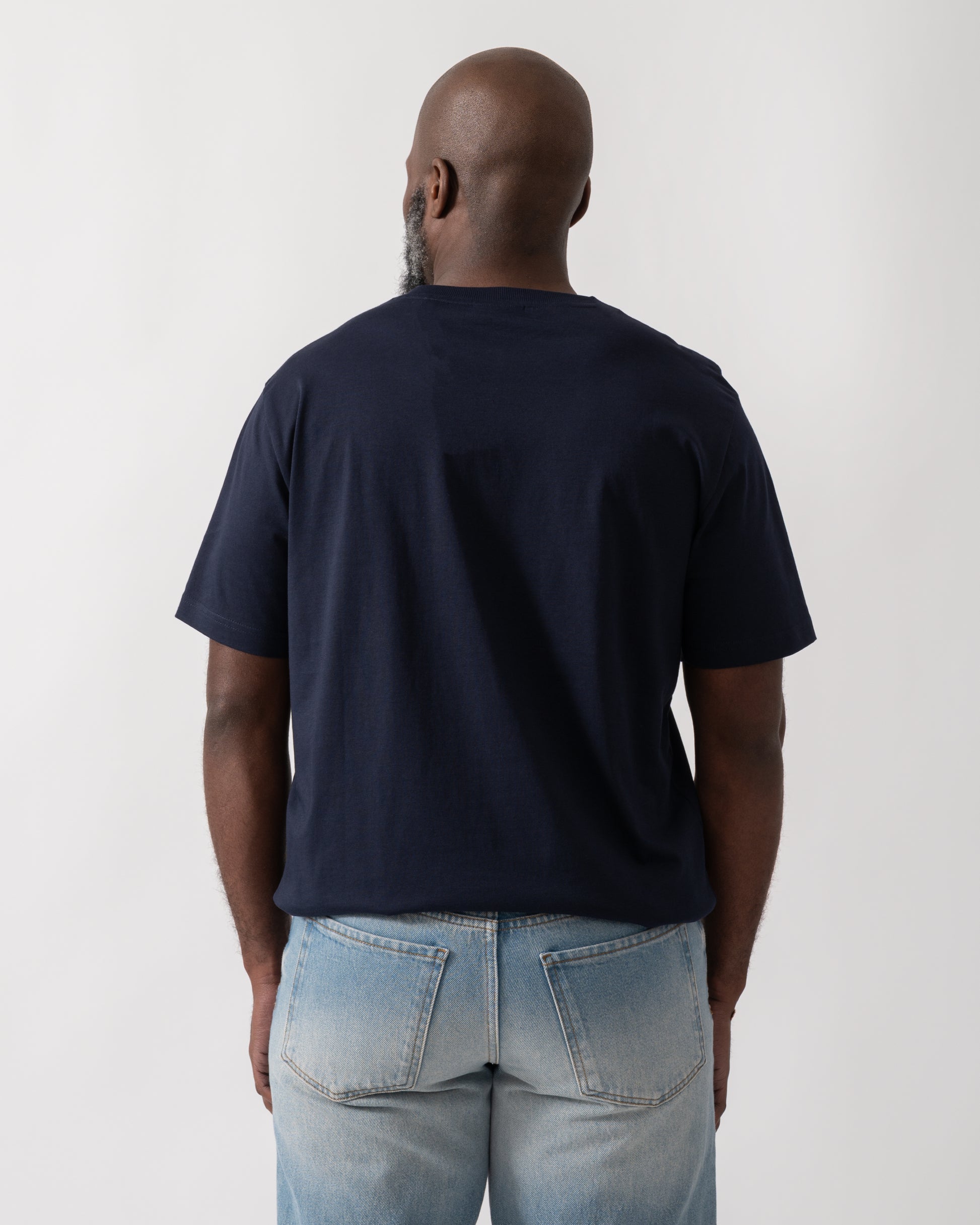 Back shot of a Model wearing a GANT Mens 1949 Graphic Short Sleeve T-Shirt in Evening Blue