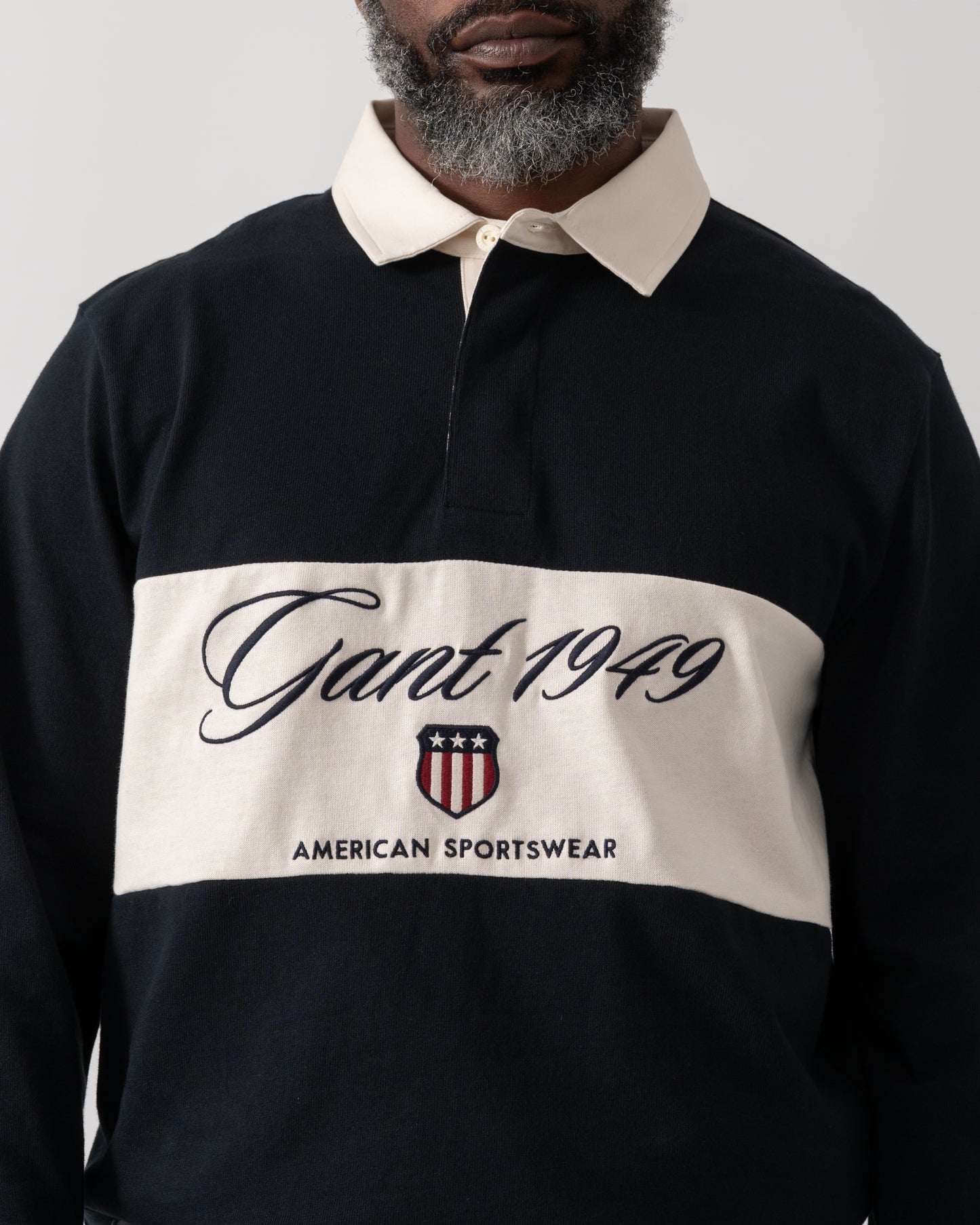 close up shot of a model wearing a GANT Mens Blocked Heavy Rugger in Black