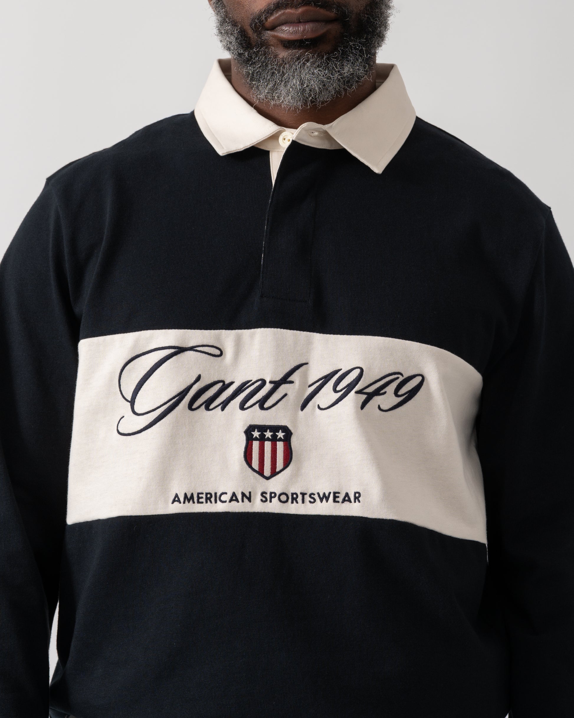 close up shot of a model wearing a GANT Mens Blocked Heavy Rugger in Black