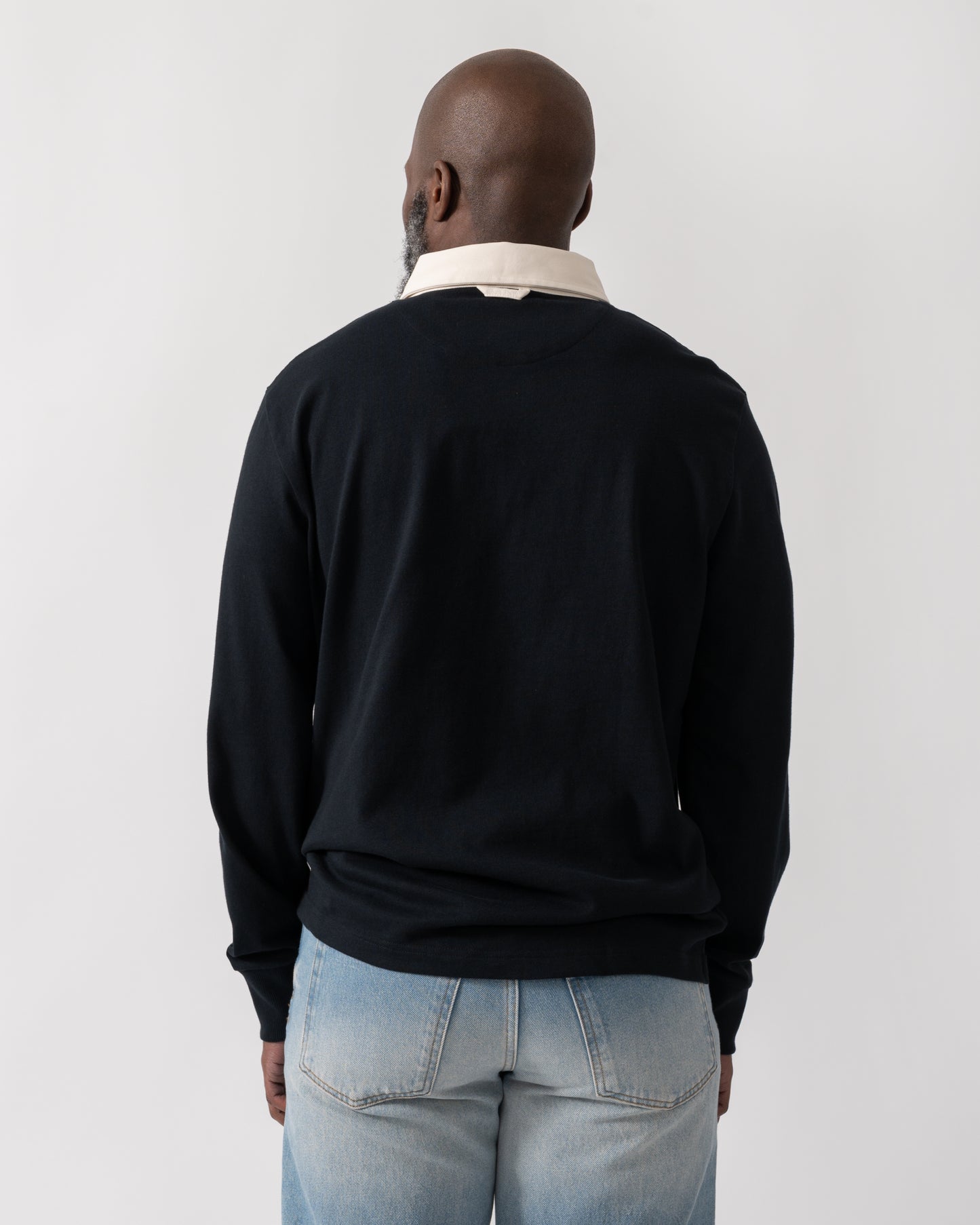 back shot of a model wearing a GANT Mens Blocked Heavy Rugger in Black