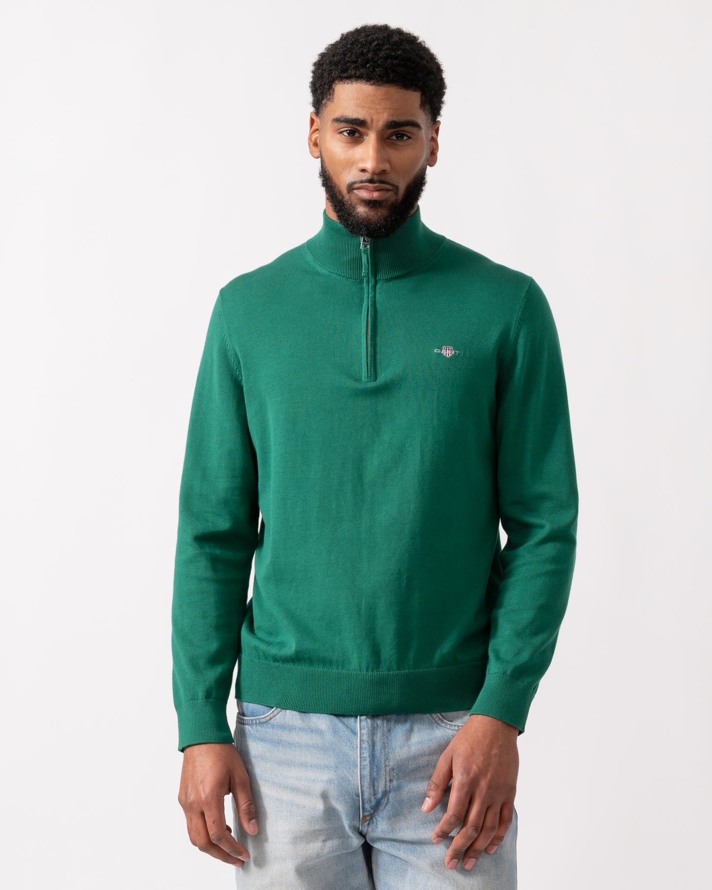 model wearing a GANT Mens Classic Cotton Half Zip Jumper in Deep Forest Green