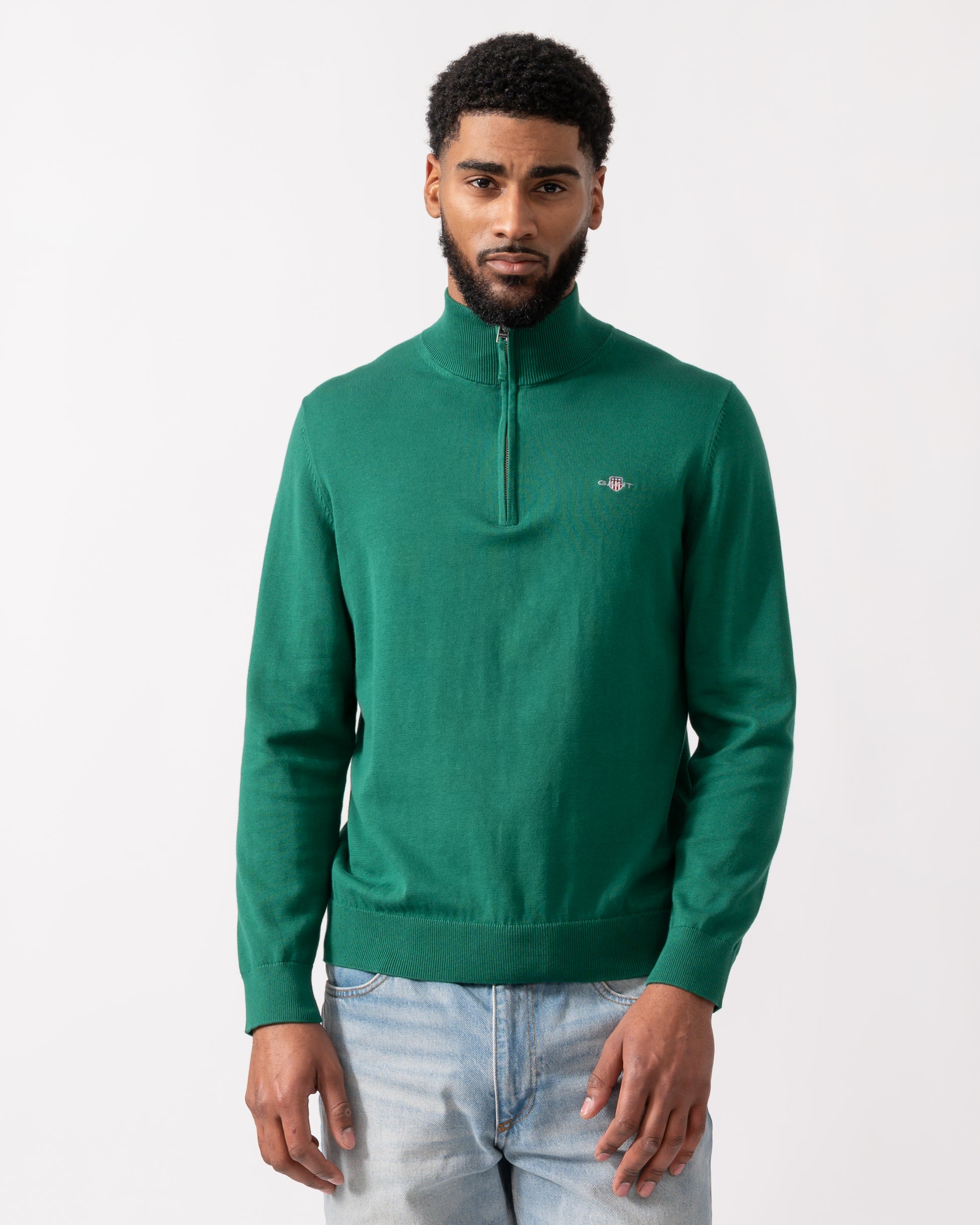 model wearing a GANT Mens Classic Cotton Half Zip Jumper in Deep Forest Green