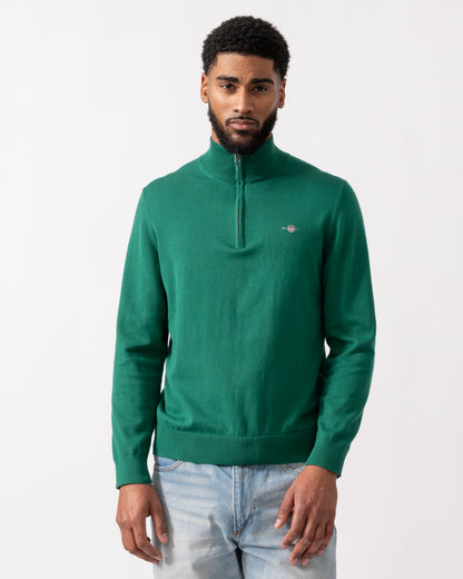 model wearing a GANT Mens Classic Cotton Half Zip Jumper in Deep Forest Green