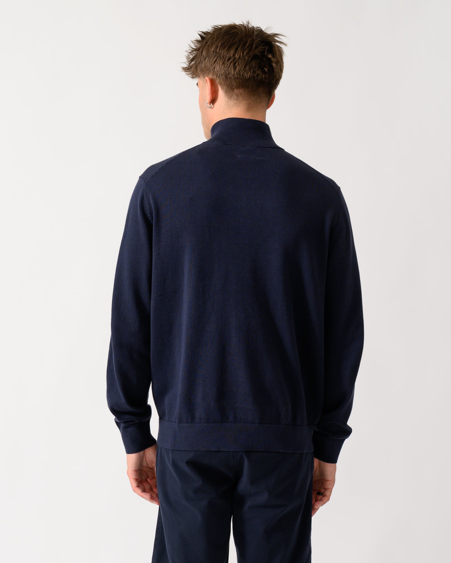 back shot of a model wearing a GANT Mens Classic Cotton Shield Logo Half Zip Jumper n 433 Evening Blue