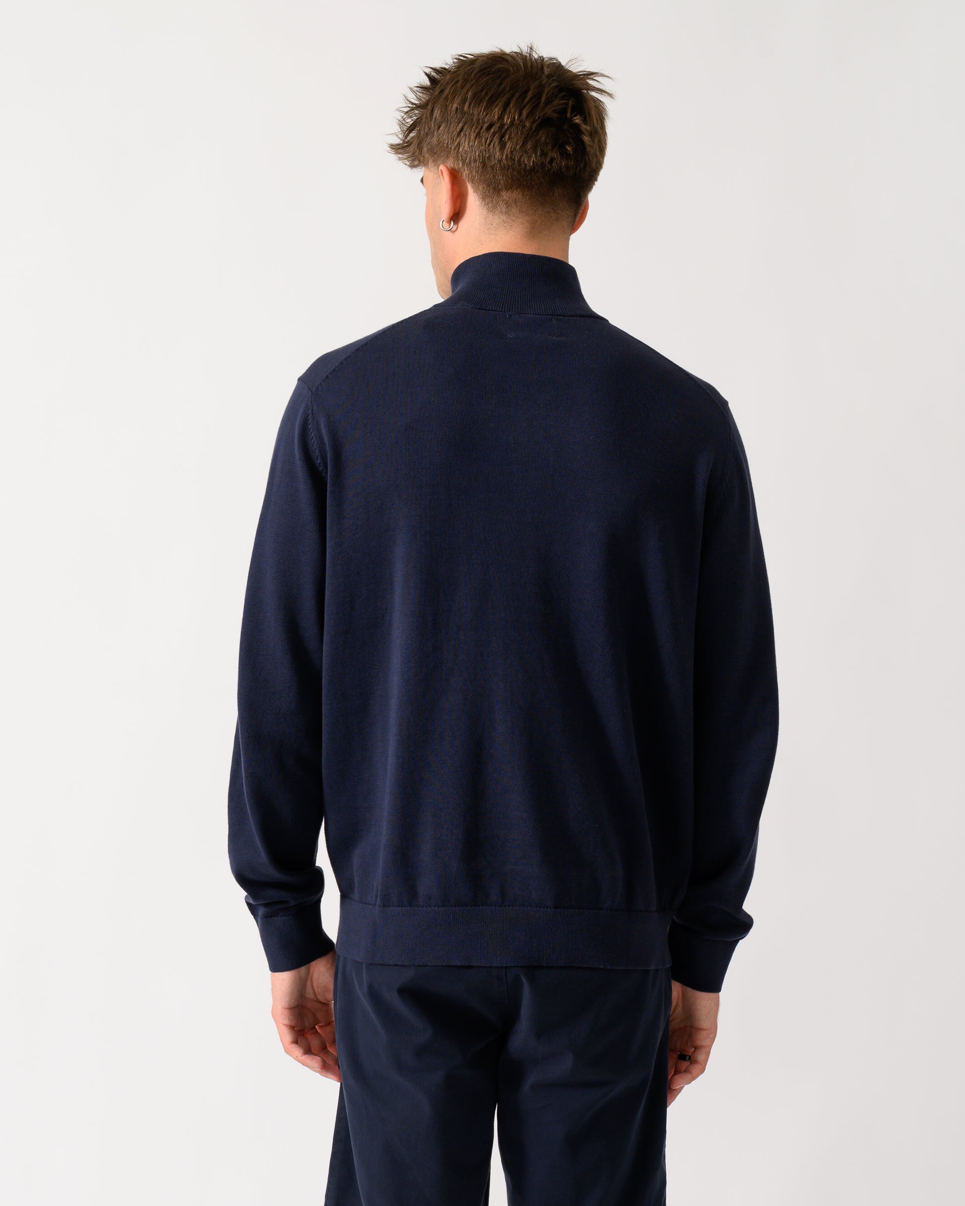 back shot of a model wearing a GANT Mens Classic Cotton Shield Logo Half Zip Jumper n 433 Evening Blue