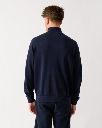 back shot of a model wearing a GANT Mens Classic Cotton Shield Logo Half Zip Jumper n 433 Evening Blue