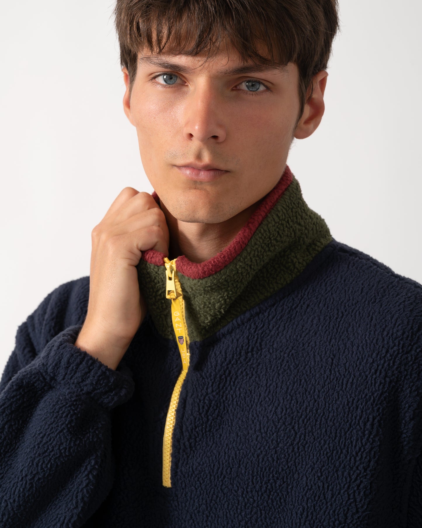 detail of a model wearing GANT Mens Color-Block Fleece in 433 Evening Blue