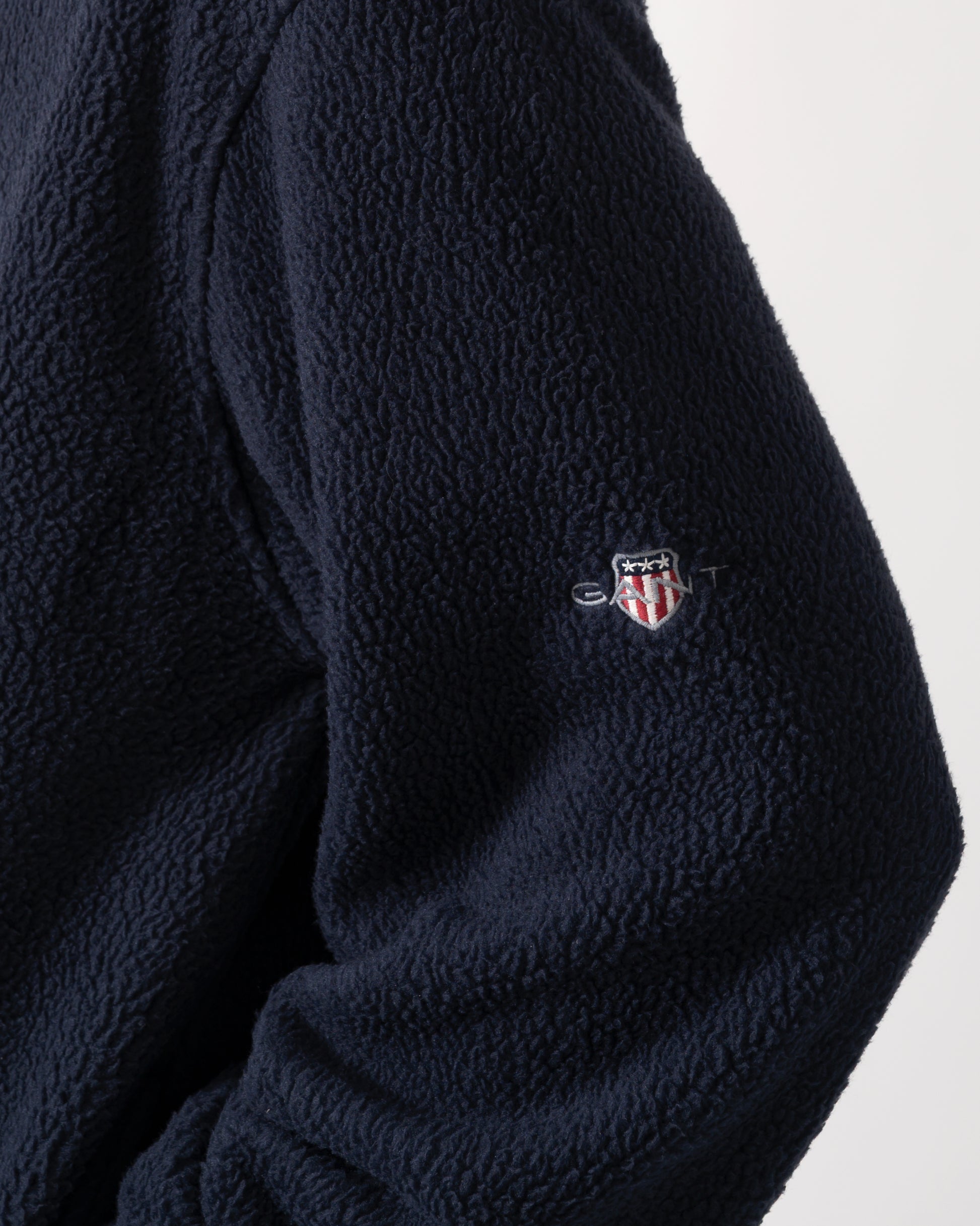 logo detail model wearing GANT Mens Color-Block Fleece in 433 Evening Blue