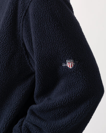 logo detail model wearing GANT Mens Color-Block Fleece in 433 Evening Blue