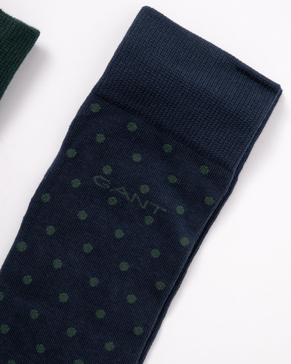 close up detail of stitched logo on GANT Mens Dot And Rib 2-Pack Sock Gift Box - 433 Evening Blue