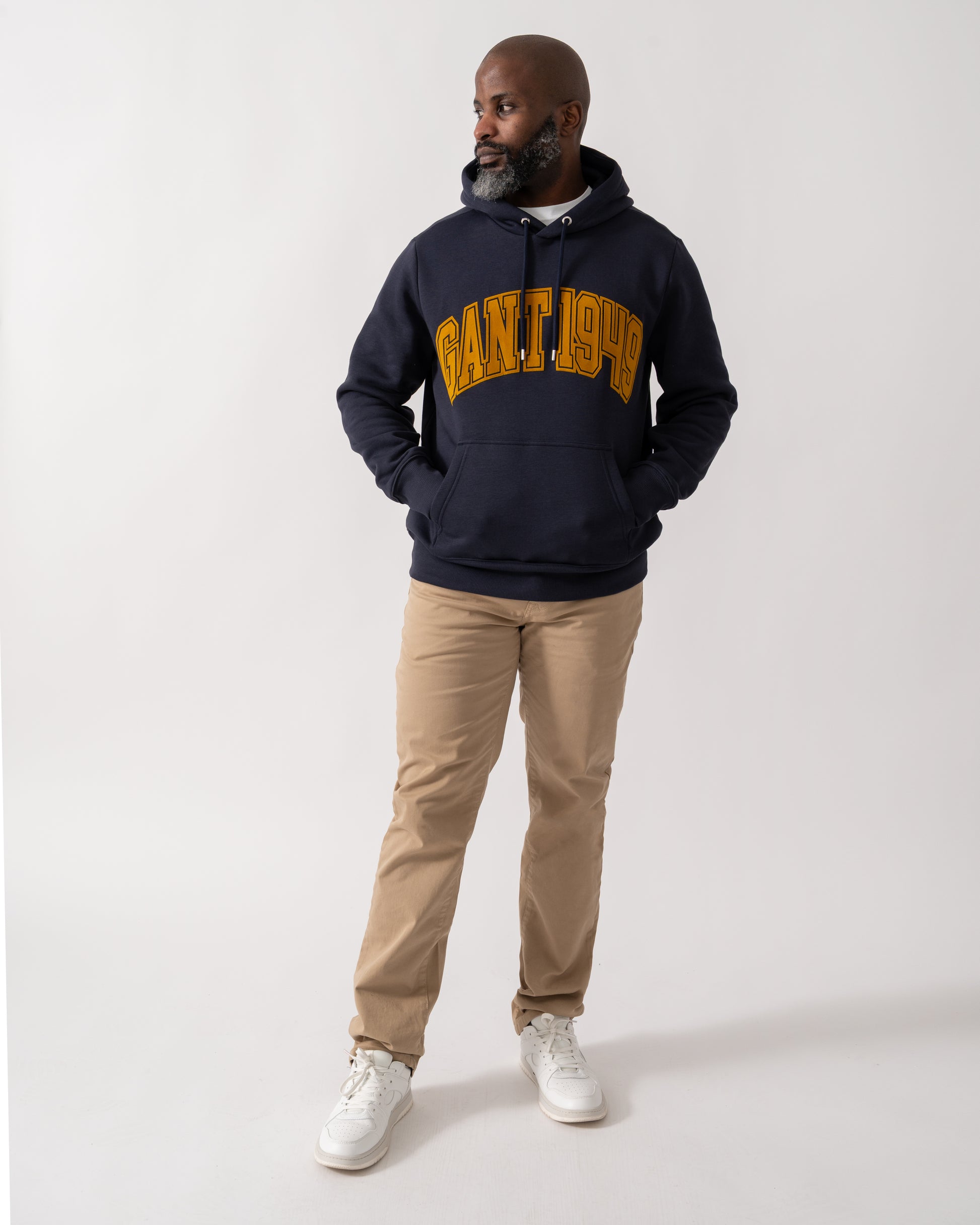 Full length shot of a Model wearing a GANT Mens Graphic Hoodie in Evening Blue