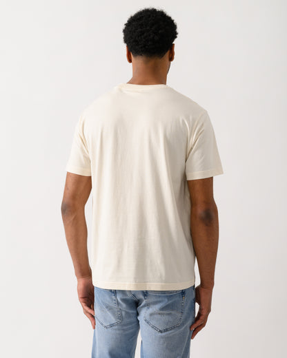 back shot of a model wearing a GANT Mens Graphic Short Sleeve T-Shirt in 130 Cream