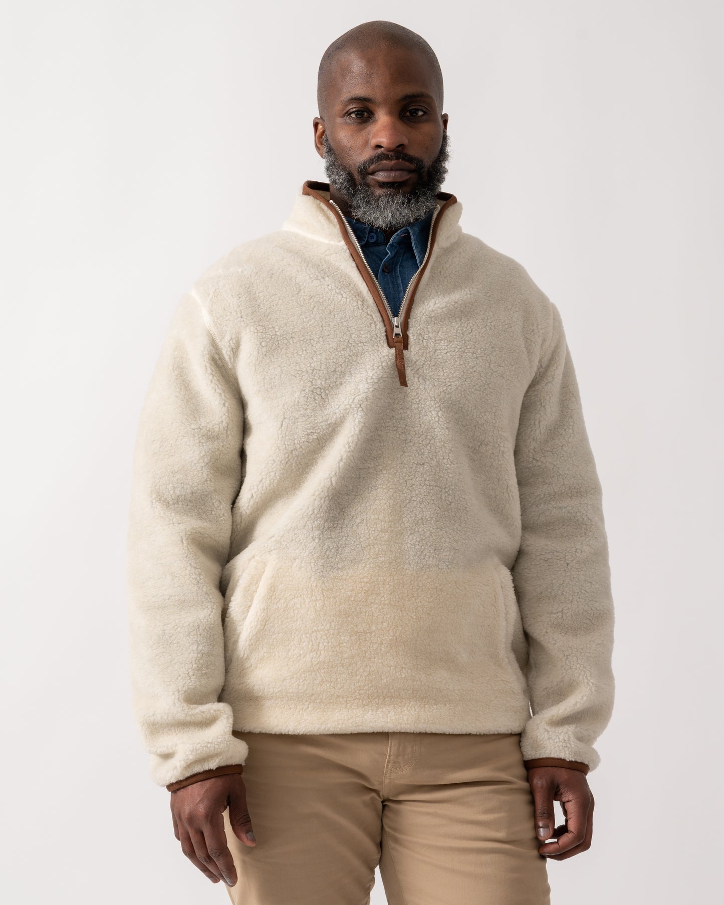 mid shot of a model wearing a GANT Mens Half Zip Fleece in Cream