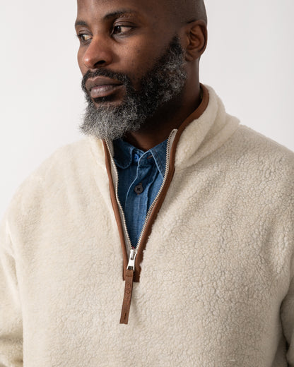 collar detail shot of a model wearing a GANT Mens Half Zip Fleece in Cream