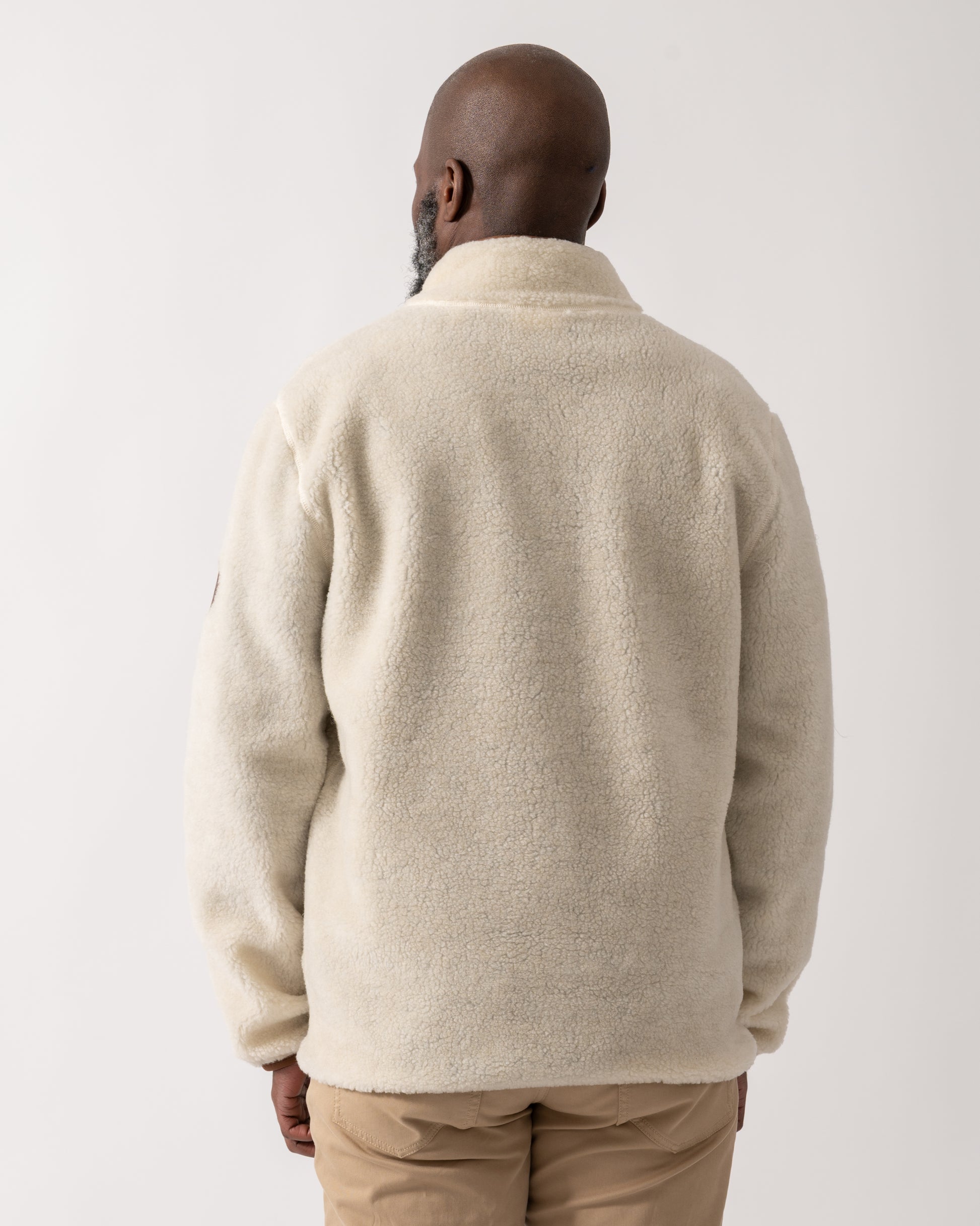 back shot of a model wearing a GANT Mens Half Zip Fleece in Cream