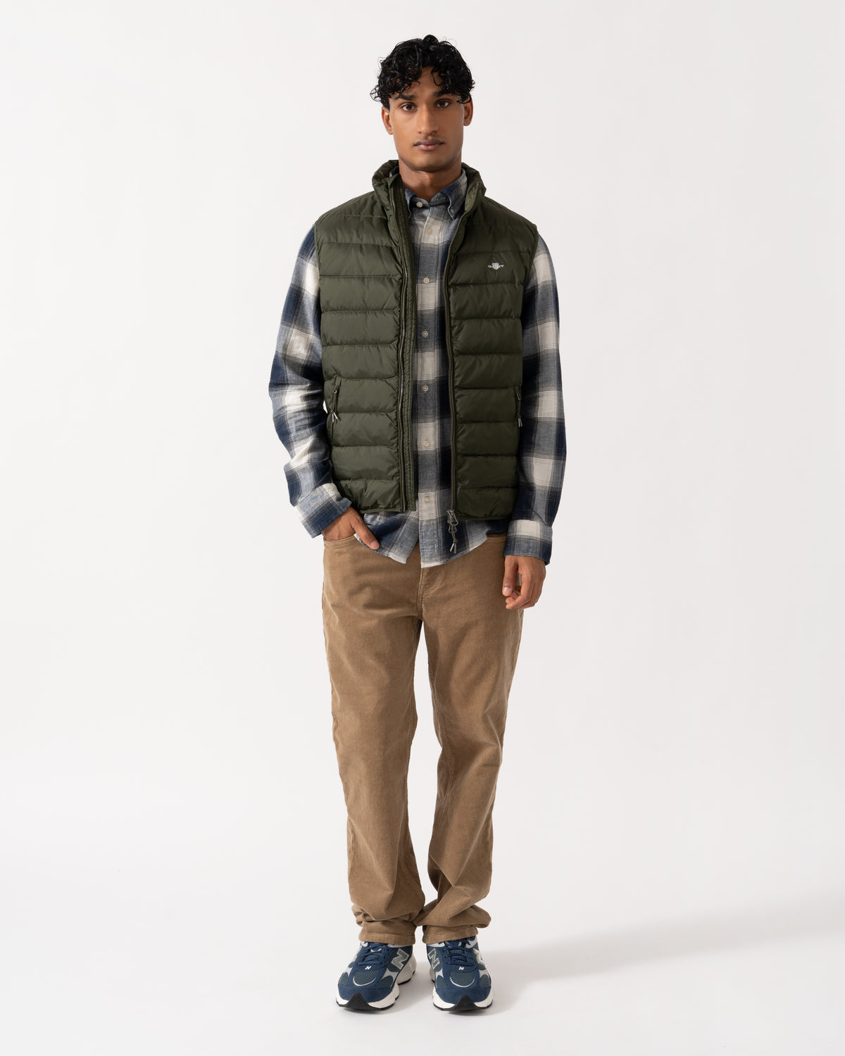 Model wearing the GANT Mens Light Down Shield Logo Gilet - 368 Dark Moss Green